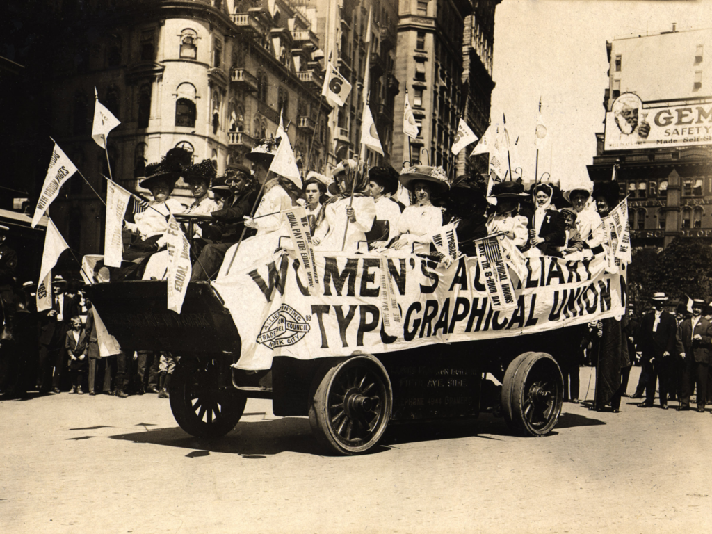 Historical image of the Women's Auxiliary Typographical Union parade float in the early 20th century. 